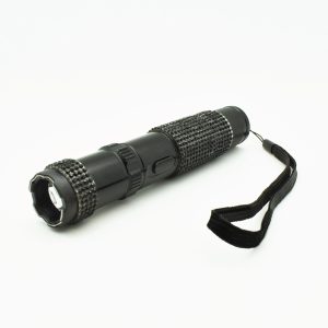 Black LED flashlight with textured grip and wrist strap on white background.