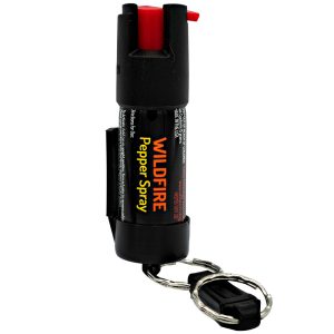 Compact Wildfire pepper spray with keychain attachment for portable self-defense.