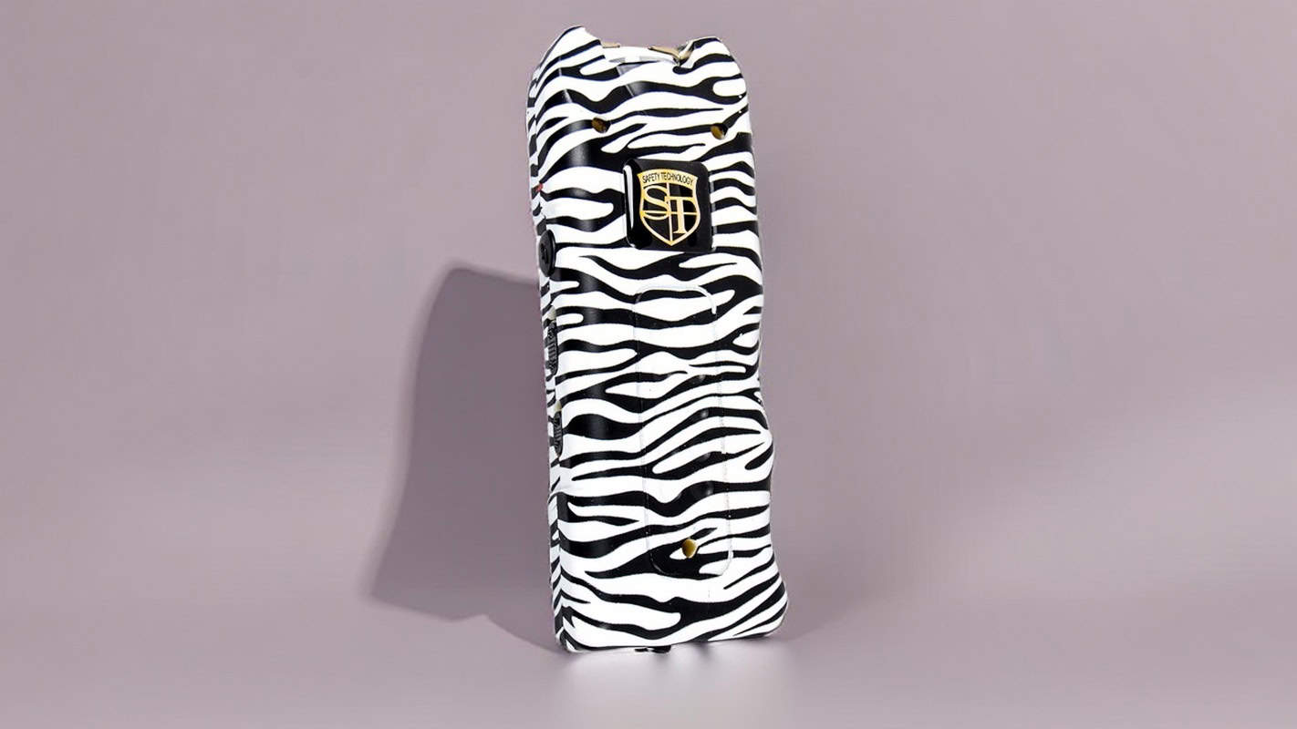 Zebra print insulated wine carrier bag with gold logo, displayed against a plain background.