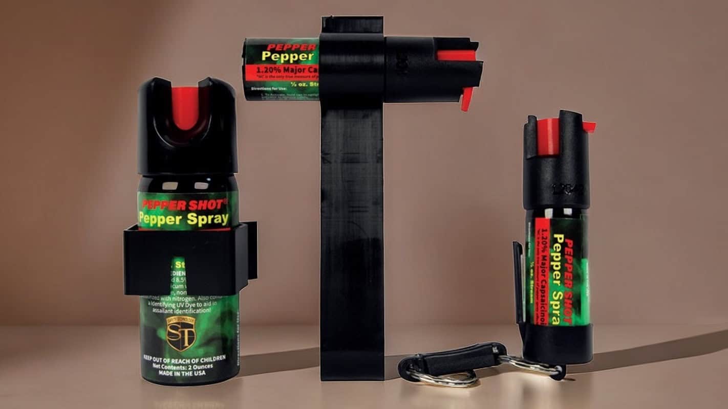 Pepper spray cans on display with keychain, effective self-defense tool for personal safety and protection.